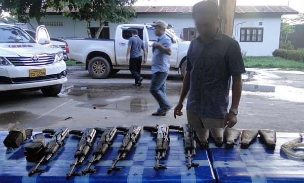 A Laotian nationality transports six AK guns into border region between Vietnam and Laos.